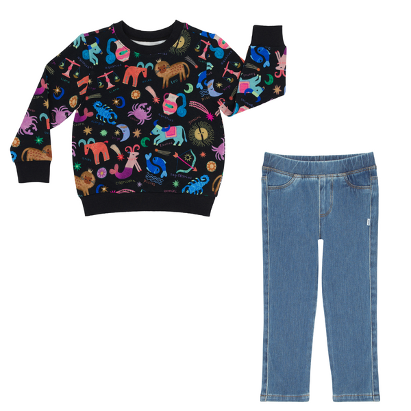 flat lay composite of a star signs crewneck sweatshirt and midwash blue denim jegging