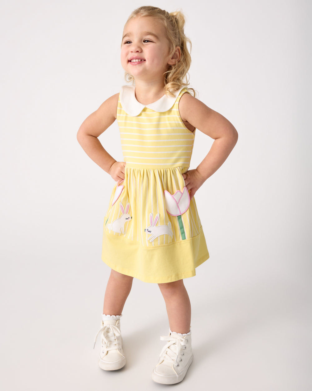 Standing girl wearing the Sunny Tulip Collar Skater Dress