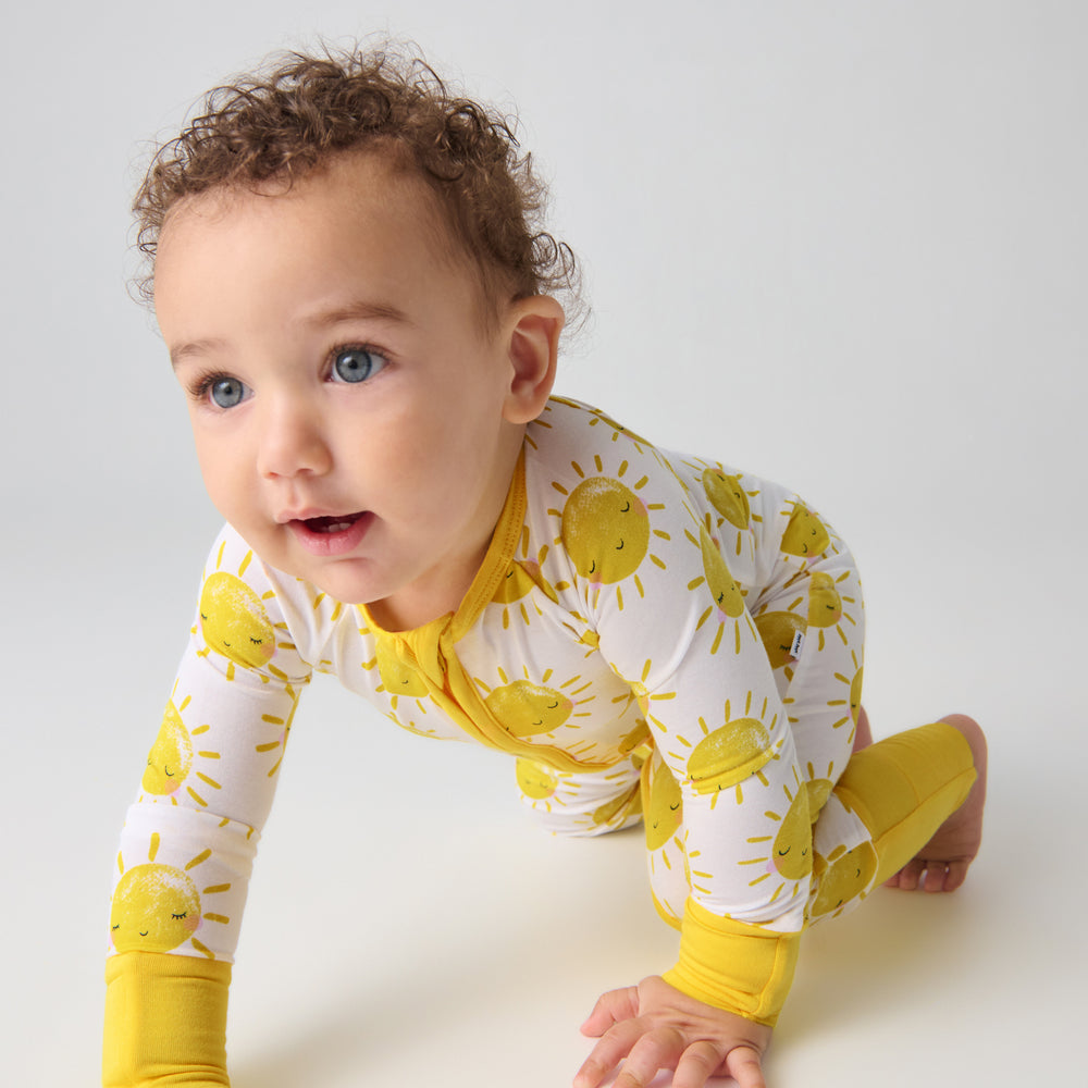 Crawling baby wearing the Sunshine Zippy