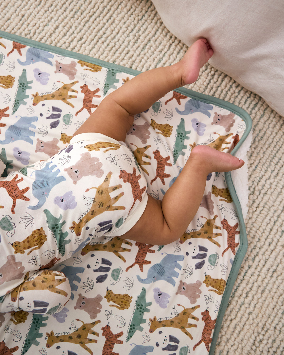 Aerial view of baby laying on the Sweet Safari Mini Cloud Blanket wearing the matching bodysuit