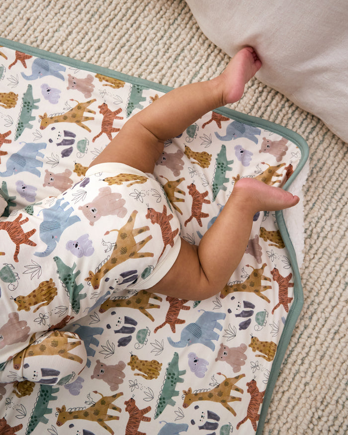 Aerial view of baby laying on the Sweet Safari Mini Cloud Blanket wearing the matching bodysuit