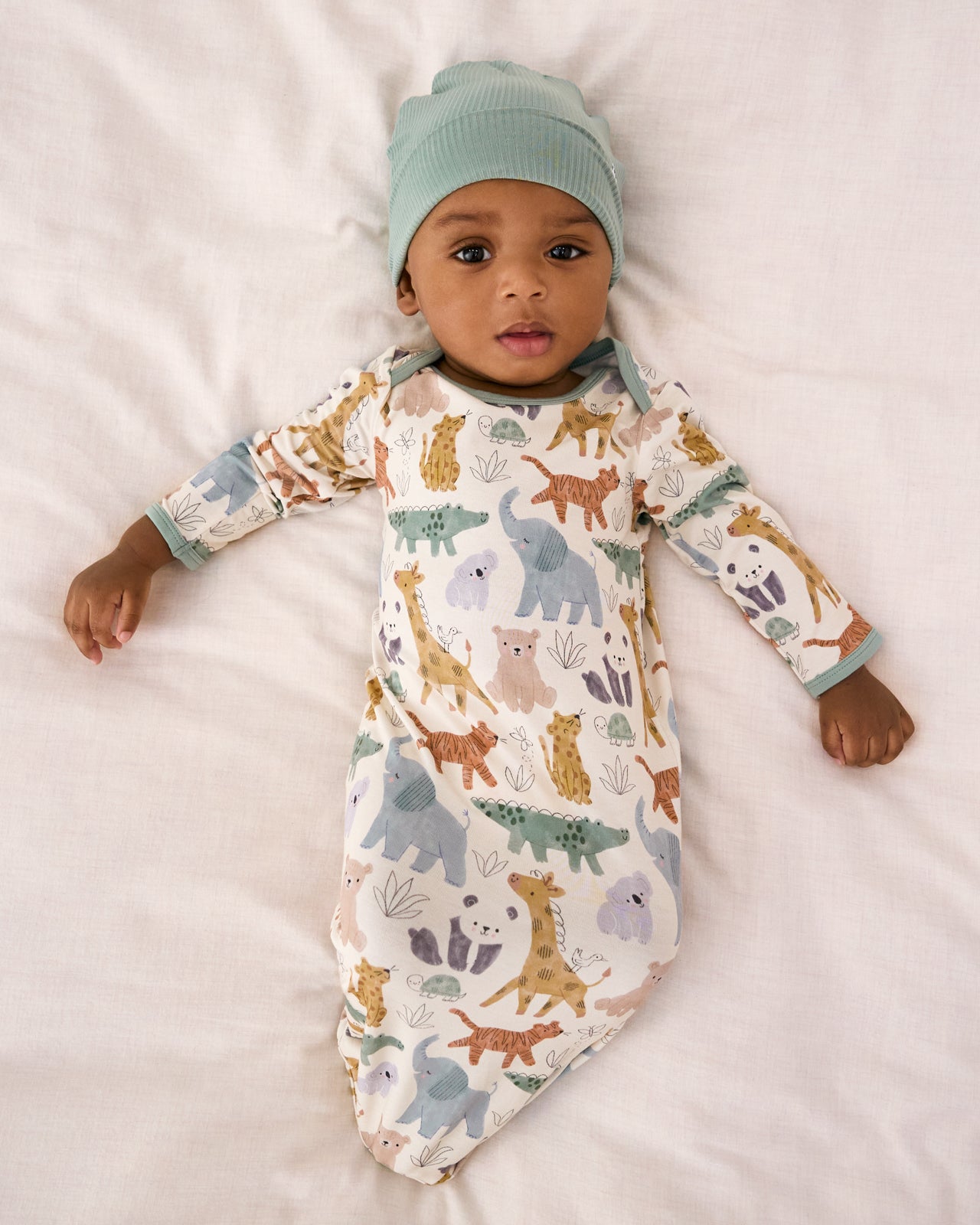 Aerial view of baby wearing the Sweet Safari Infant Gown