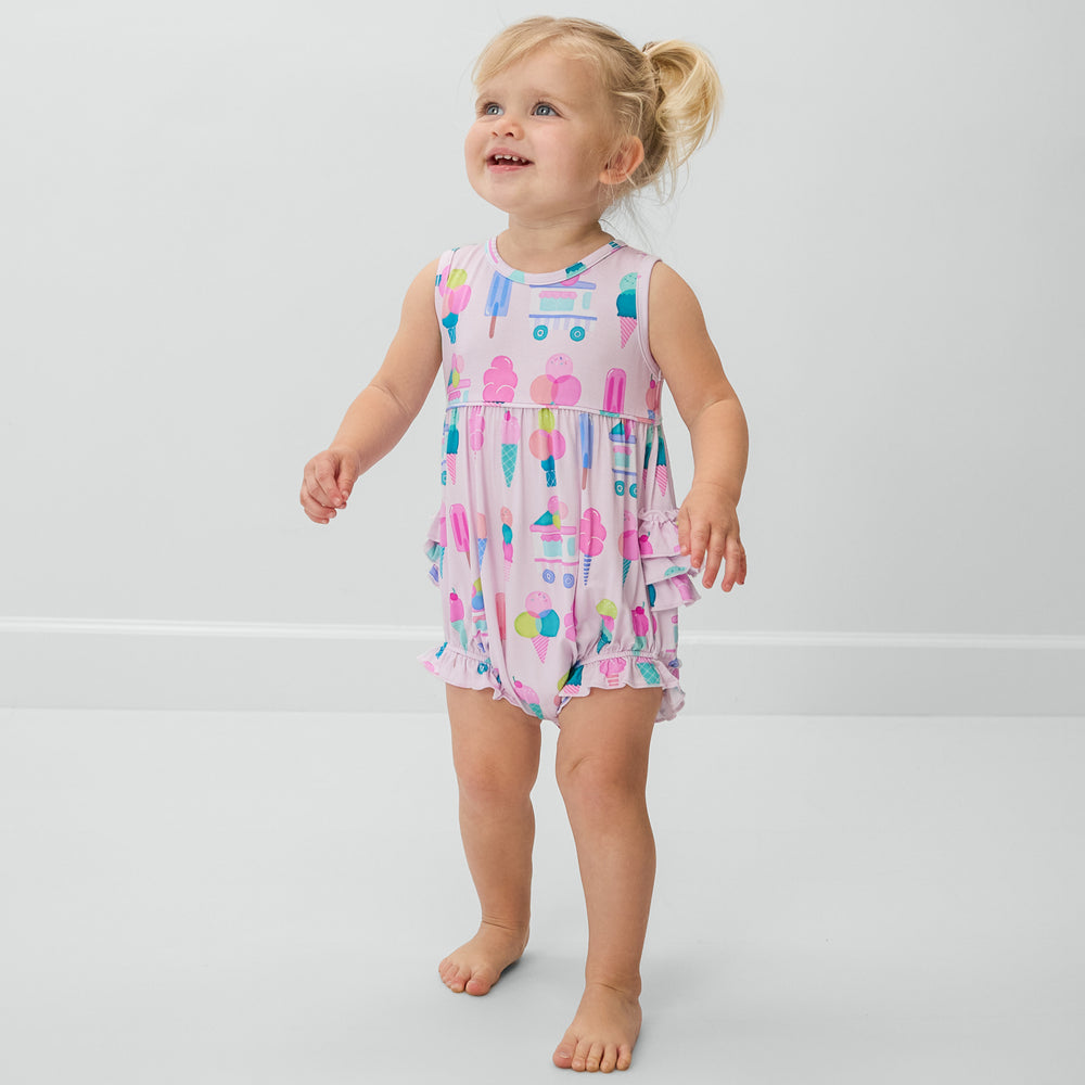 Standing child wearing the Pink Sweet Scoops Bubble Romper