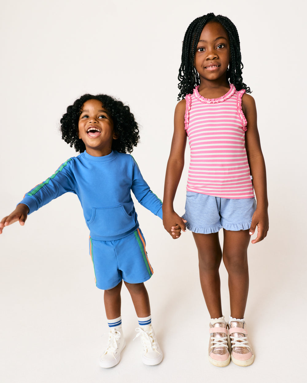 Two children wearing Play styles from the Spring Capsule