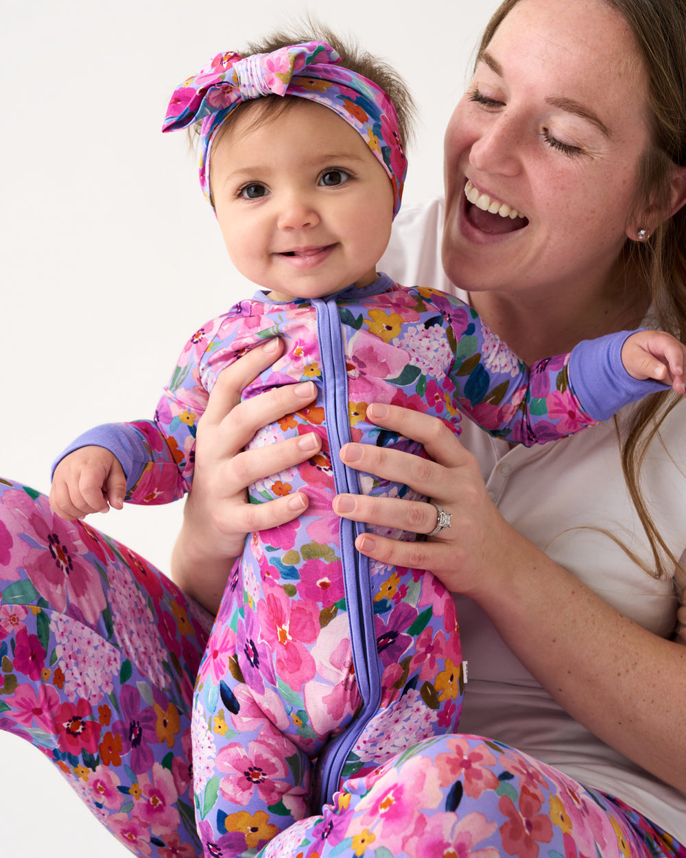 Baby wearing the Sweet Sprigs Zippy and Luxe Bow Headband 
