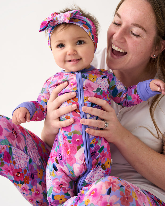 Baby wearing the Sweet Sprigs Zippy and Luxe Bow Headband 