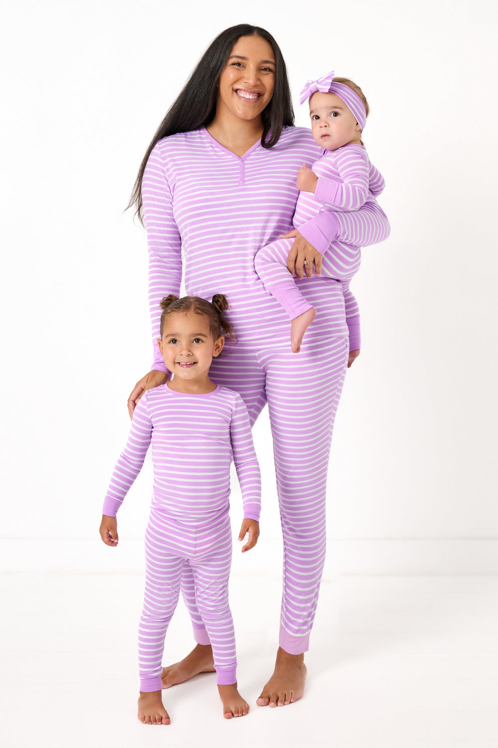 Mother and two children wearing matching Sweet Orchid Striped Pajamas