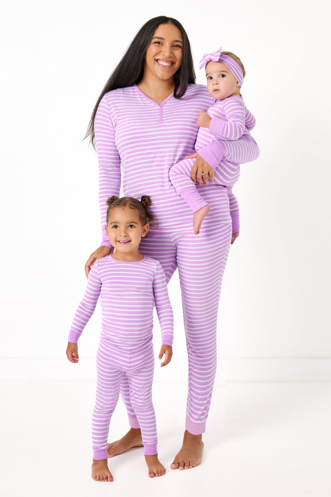 Mother and two children wearing matching Sweet Orchid Striped Pajamas