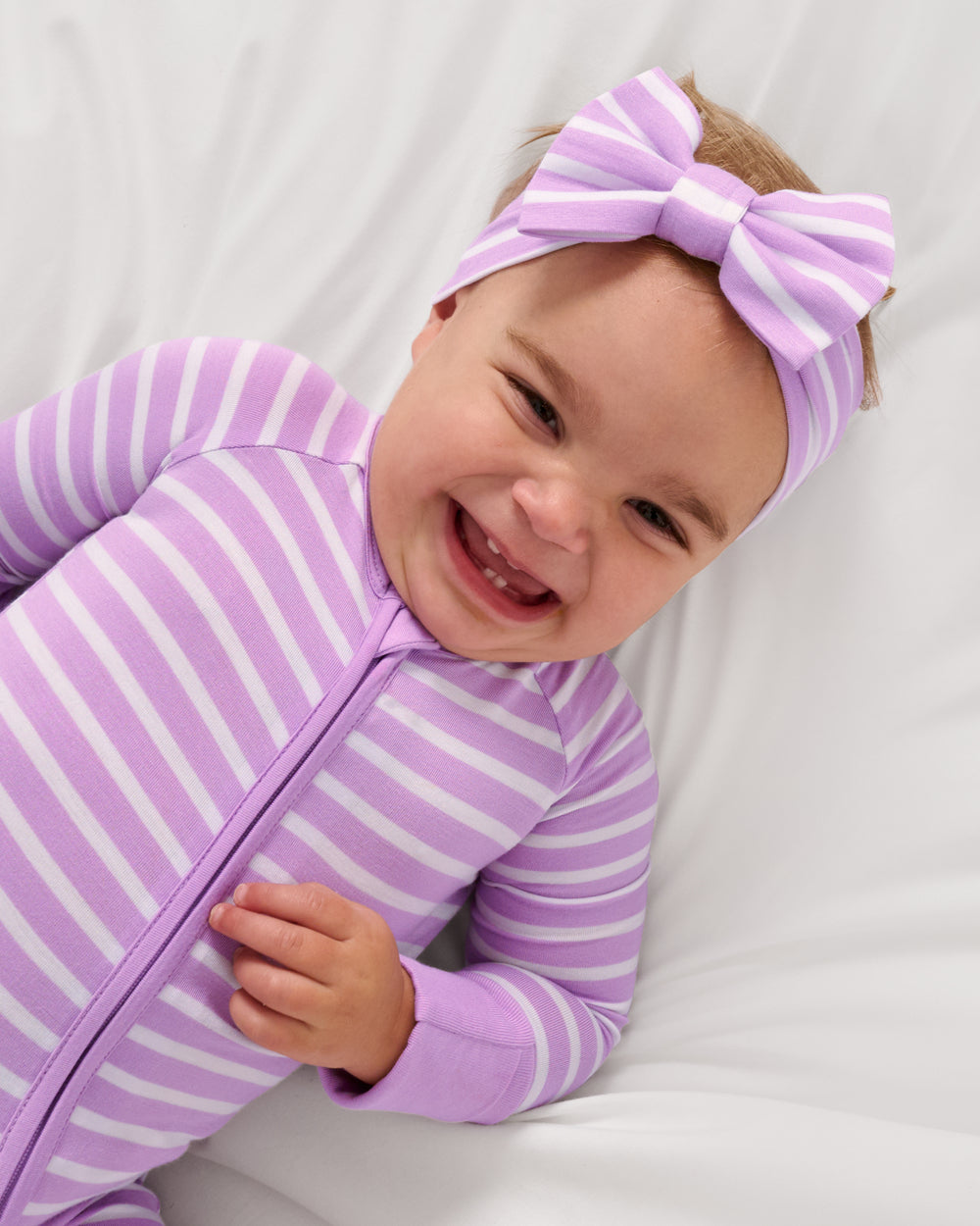 Close up of the Sweet Orchid Stripe Zippy and Bow