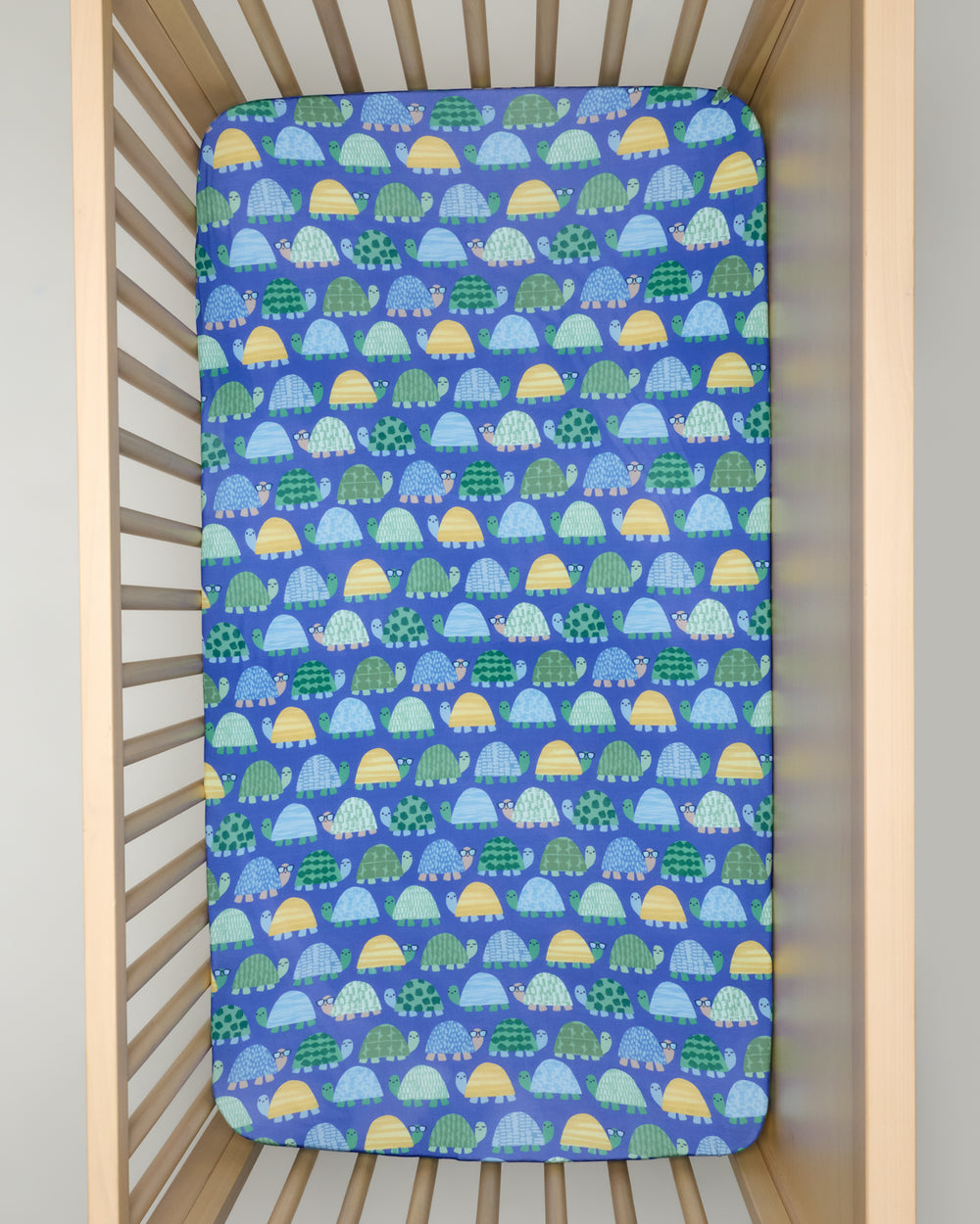 Overhead view of the Shell Parade Fitted Crib Sheet