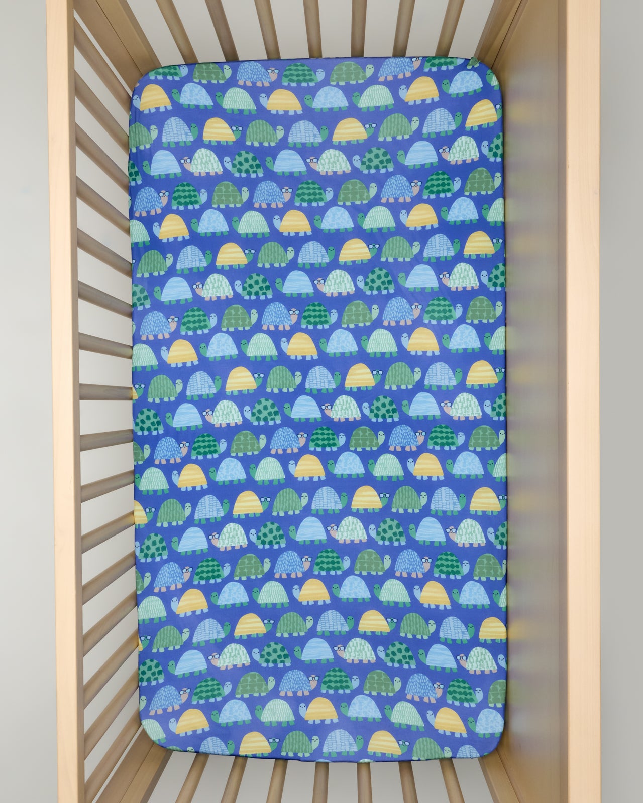Overhead view of the Shell Parade Fitted Crib Sheet