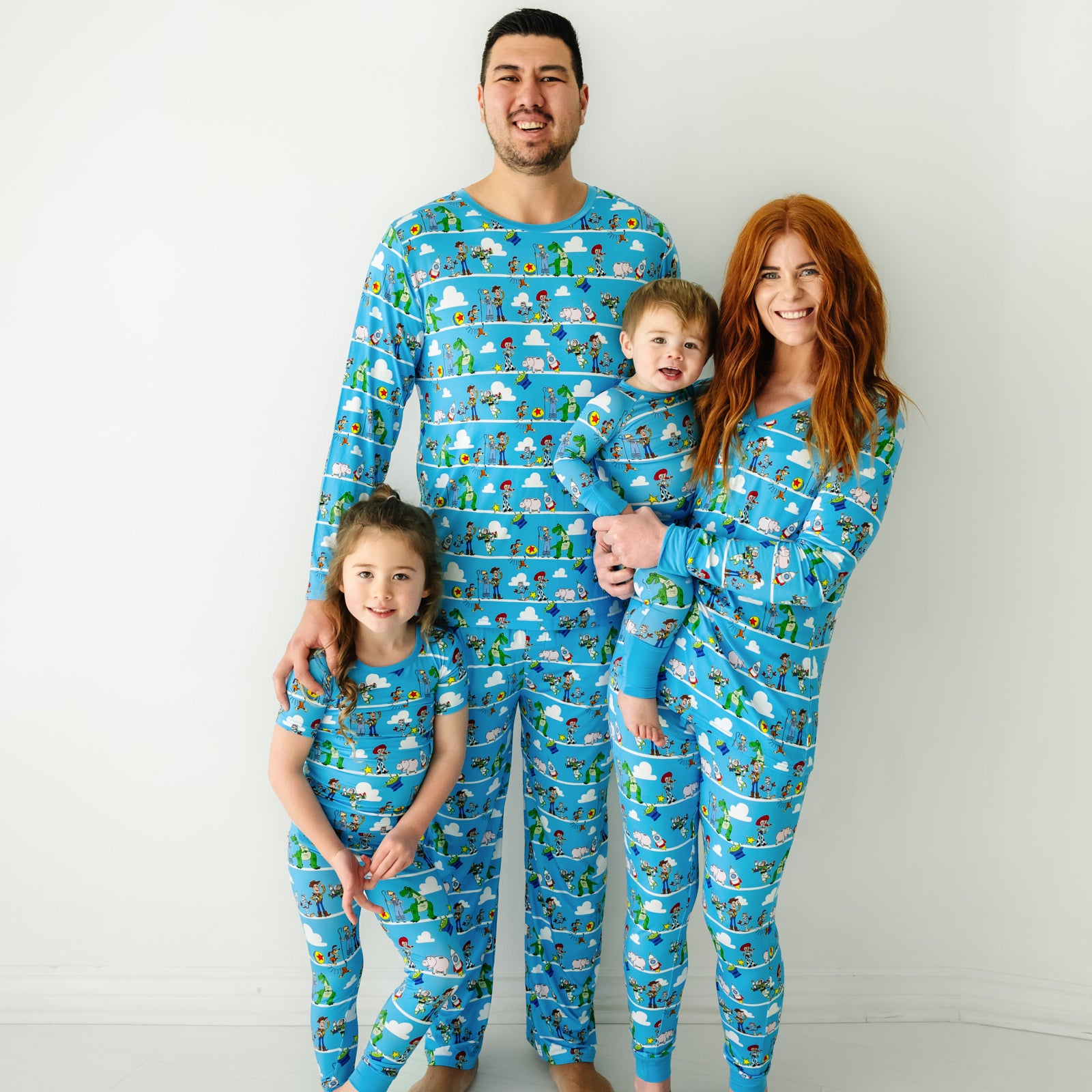 Family of four wearing matching Disney Pixar Toy Story Pals pajamas