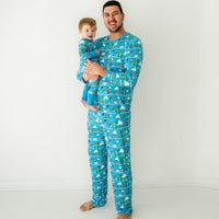 Father and son wearing matching Disney Pixar Toy Story Pals pajamas