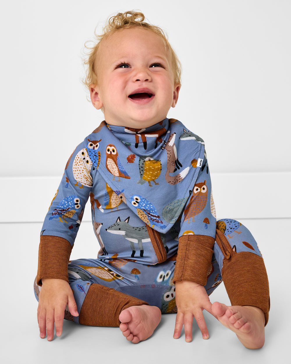 Sitting child wearing the Twilight Pals Bandana Bib