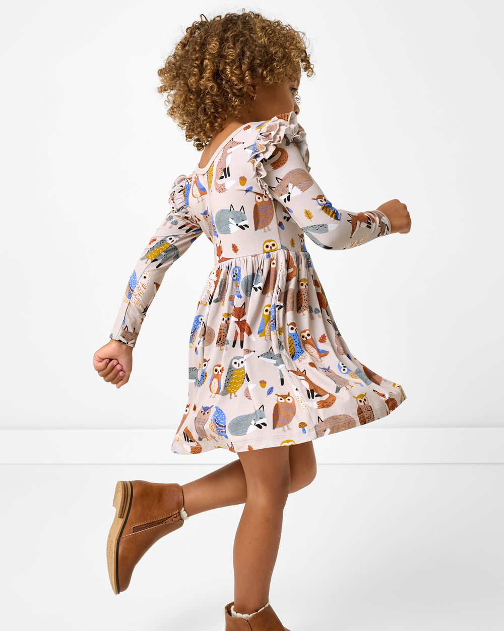 Child in motion wearing the Twilight Pals Flutter Skater Dress