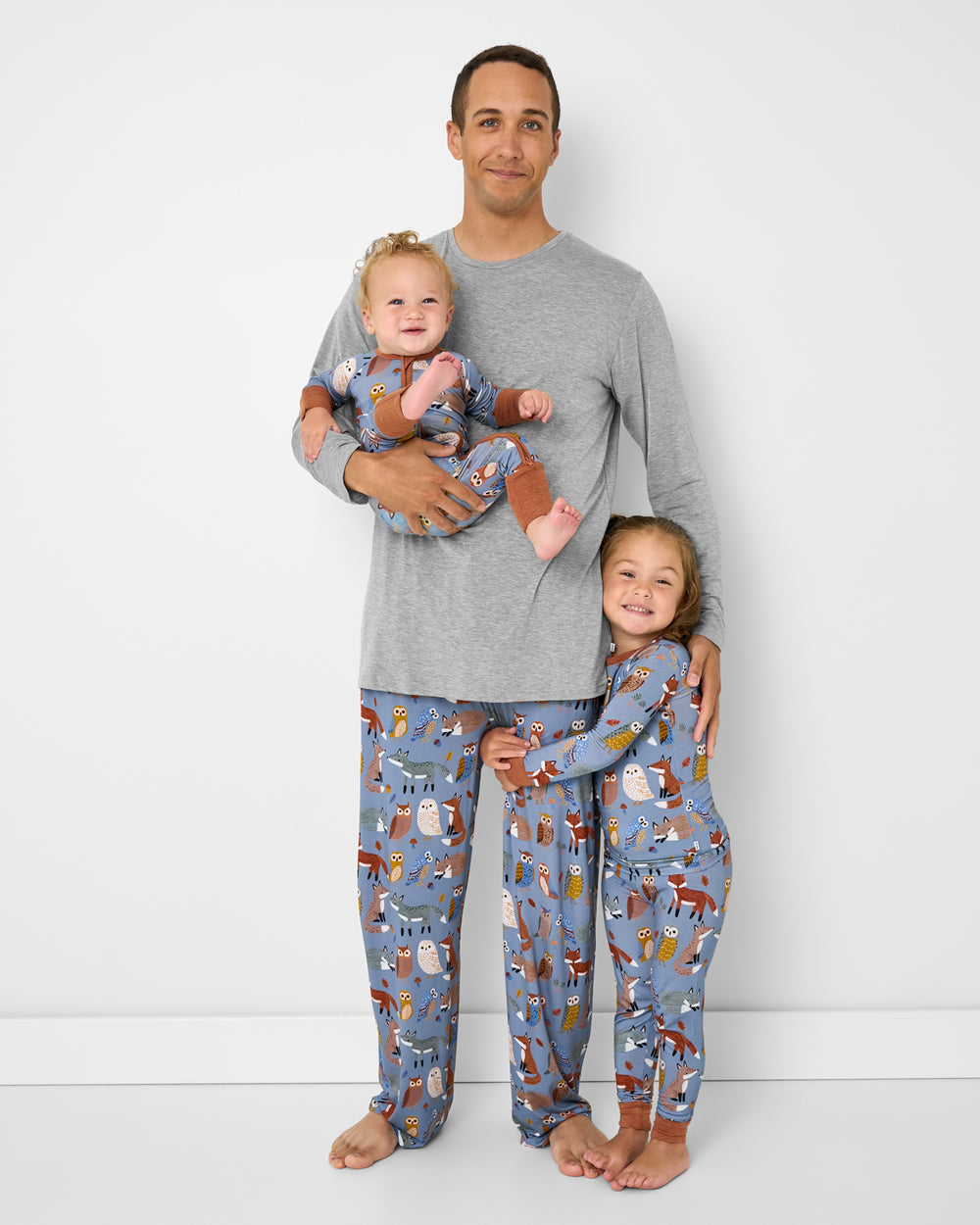 Father and two children wearing matching Twilight Pals pajamas