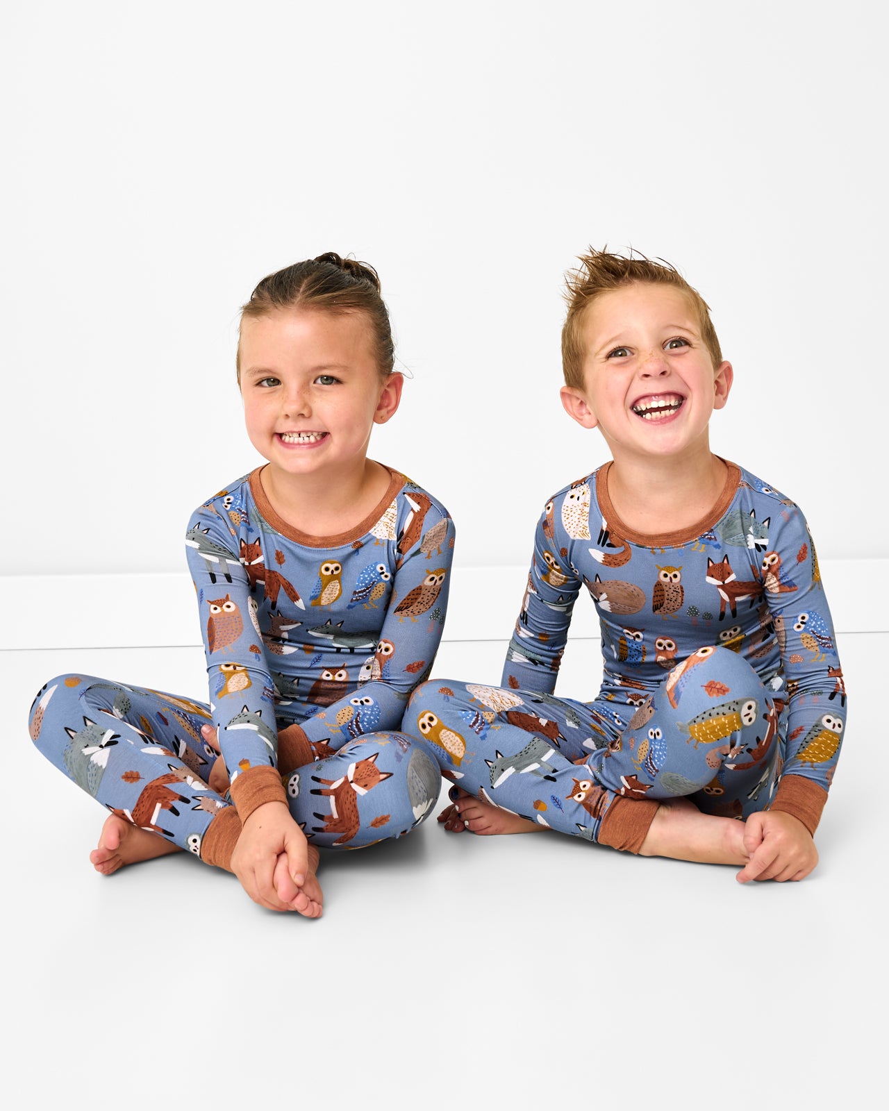 Two children wearing the Twilight Pals Two-Piece Pajama Set