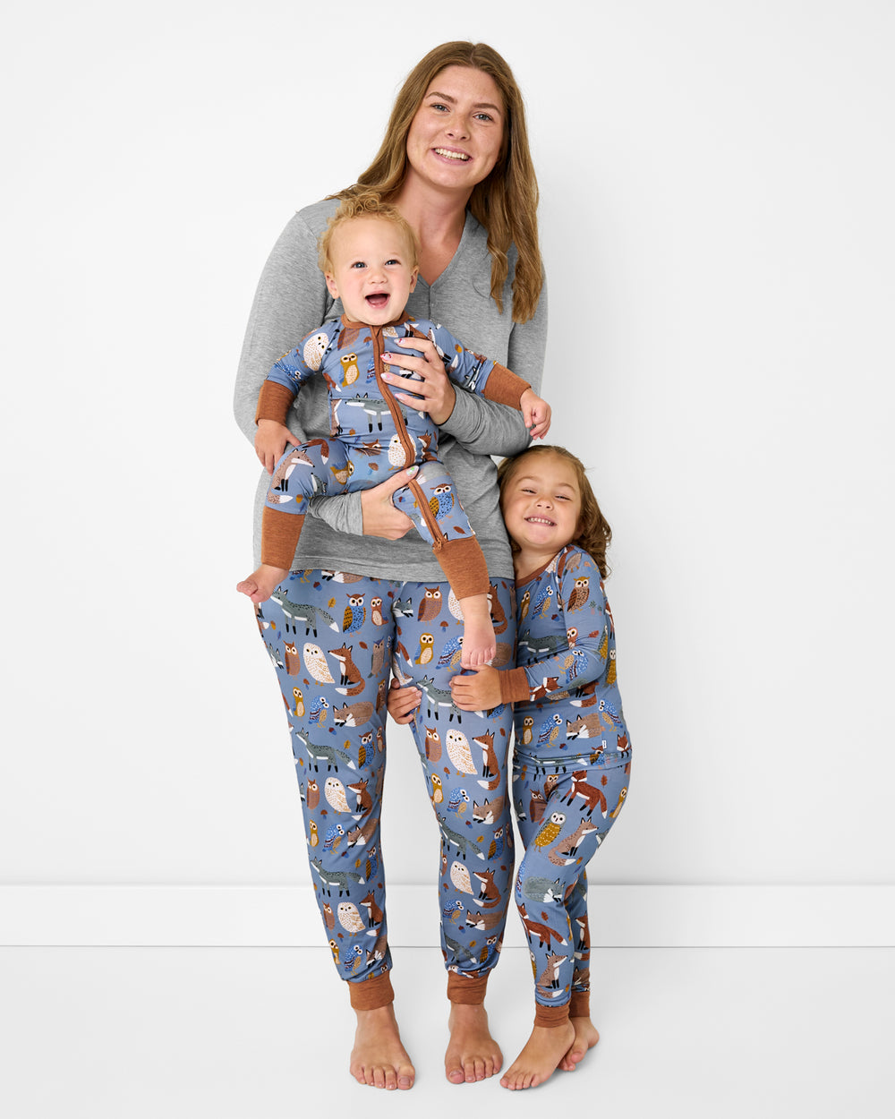 Mother and two children wearing matching Twilight Pals pajamas