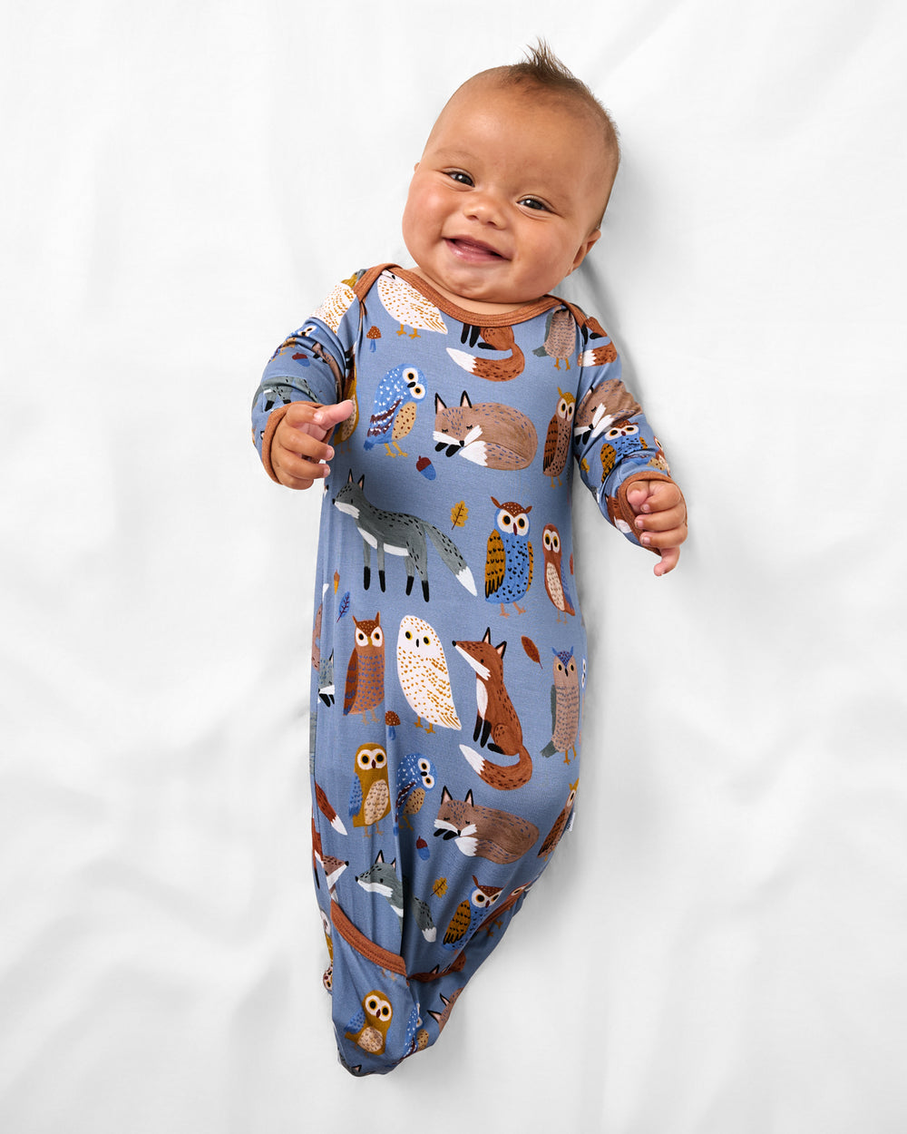 Aerial view of baby wearing the Twilight Pals Infant Gown