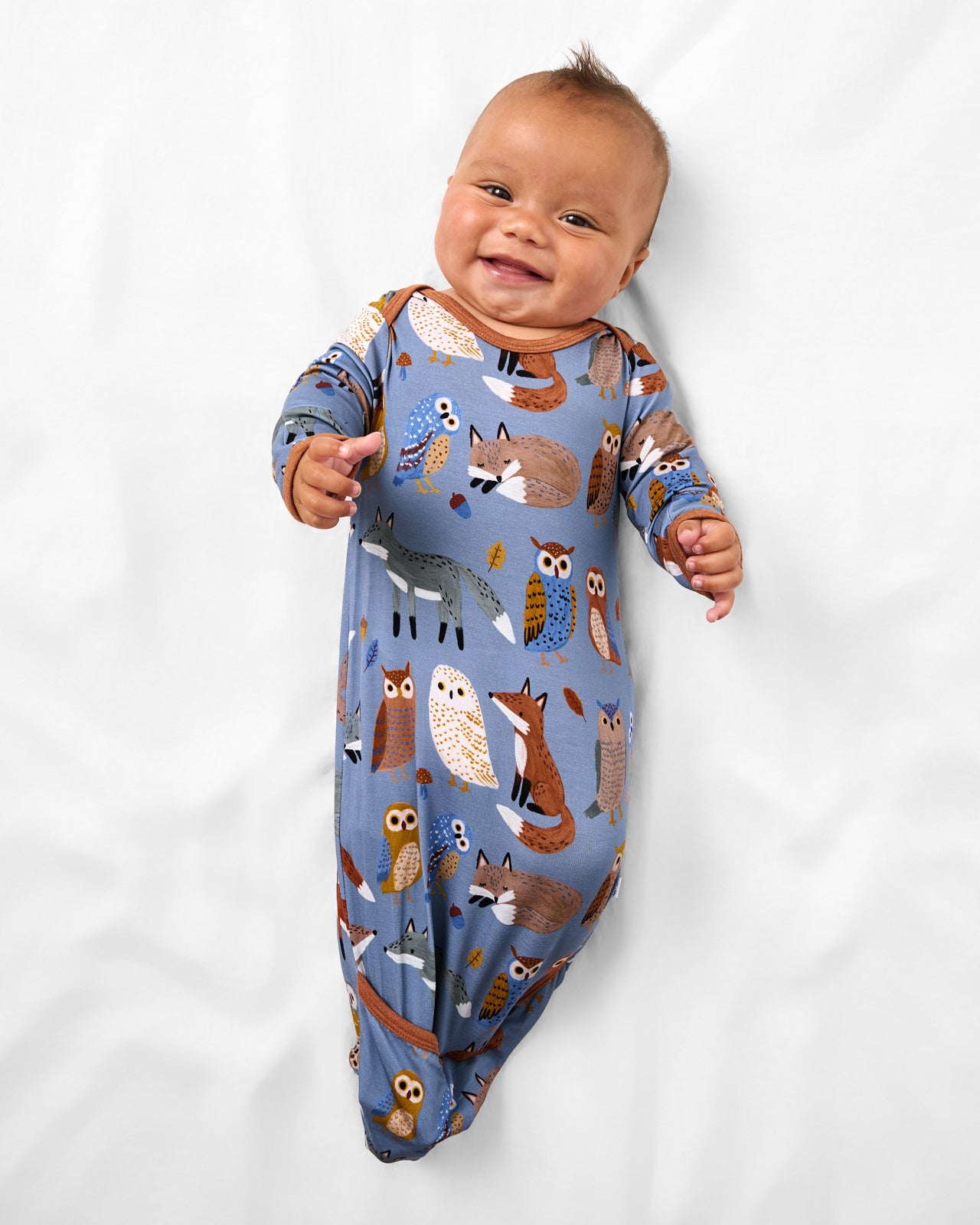 Aerial view of baby wearing the Twilight Pals Infant Gown