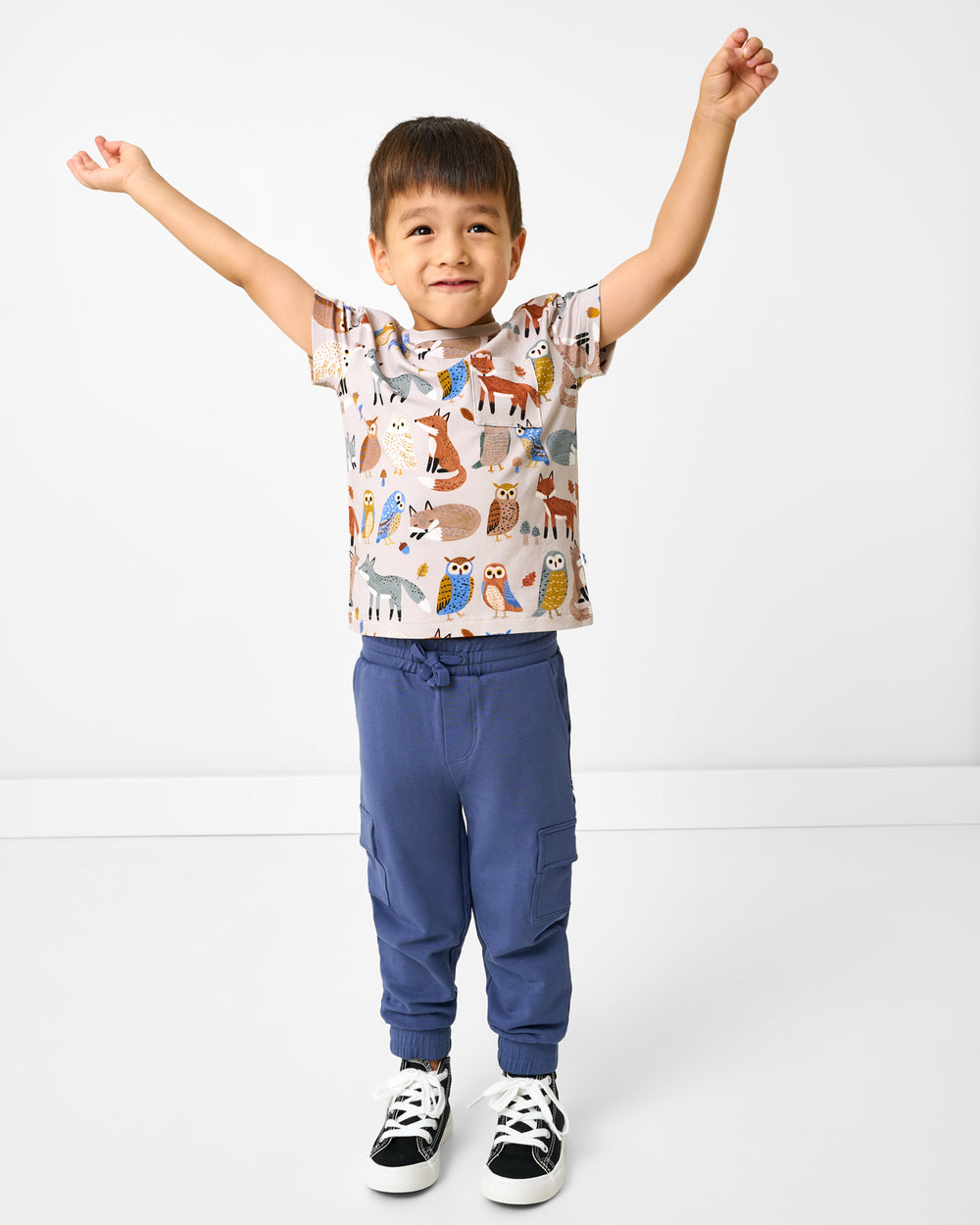 Boy wearing the Twilight Pals Relaxed Pocket Tee with cargo joggers
