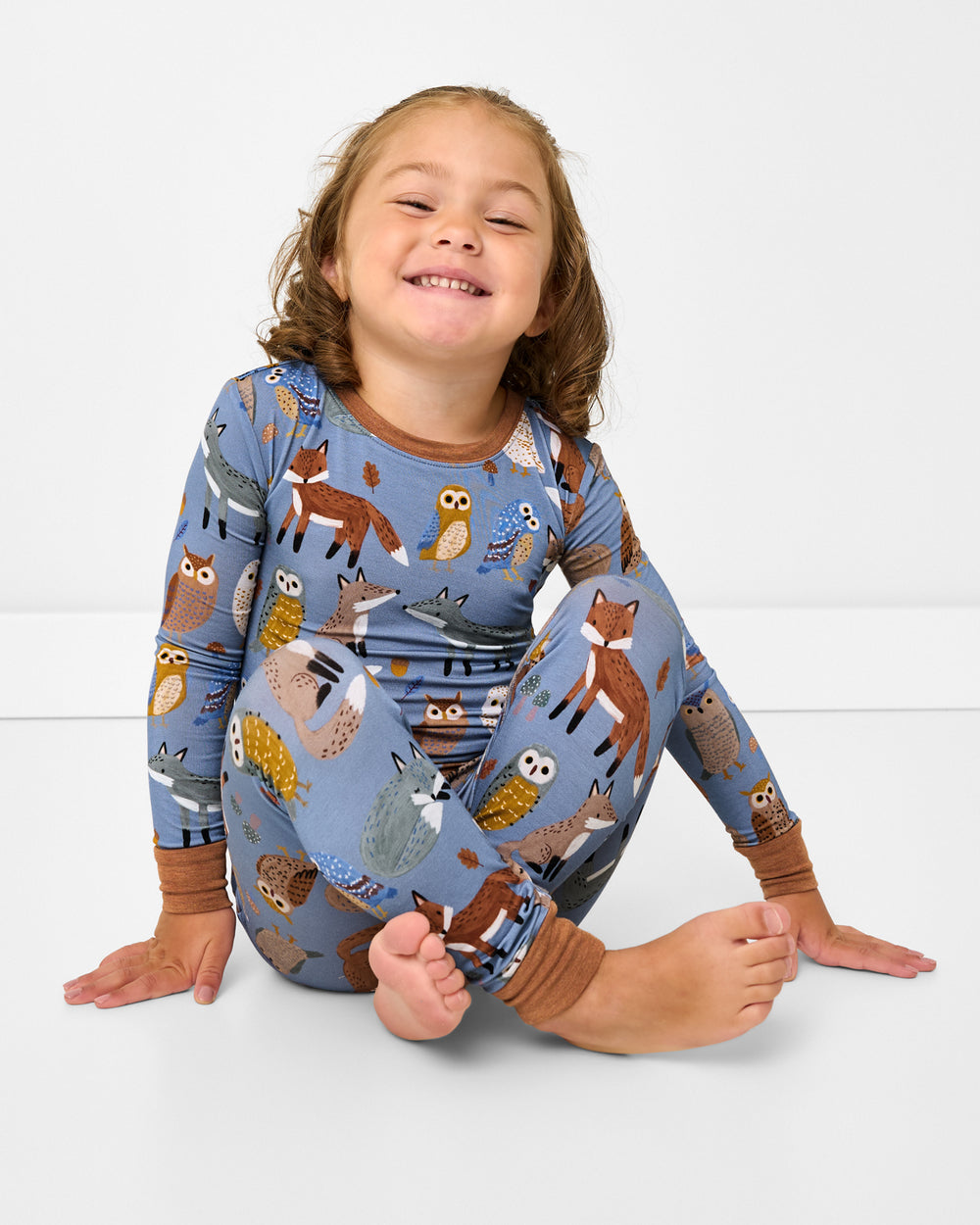 Sitting girl wearing the Twilight Pals Two-Piece Pajama Set