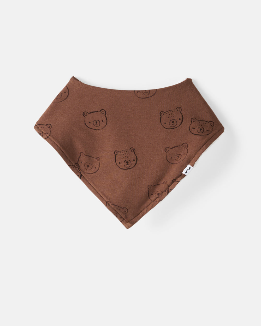 Flat lay of the Teddy Tracks Bandana Bib