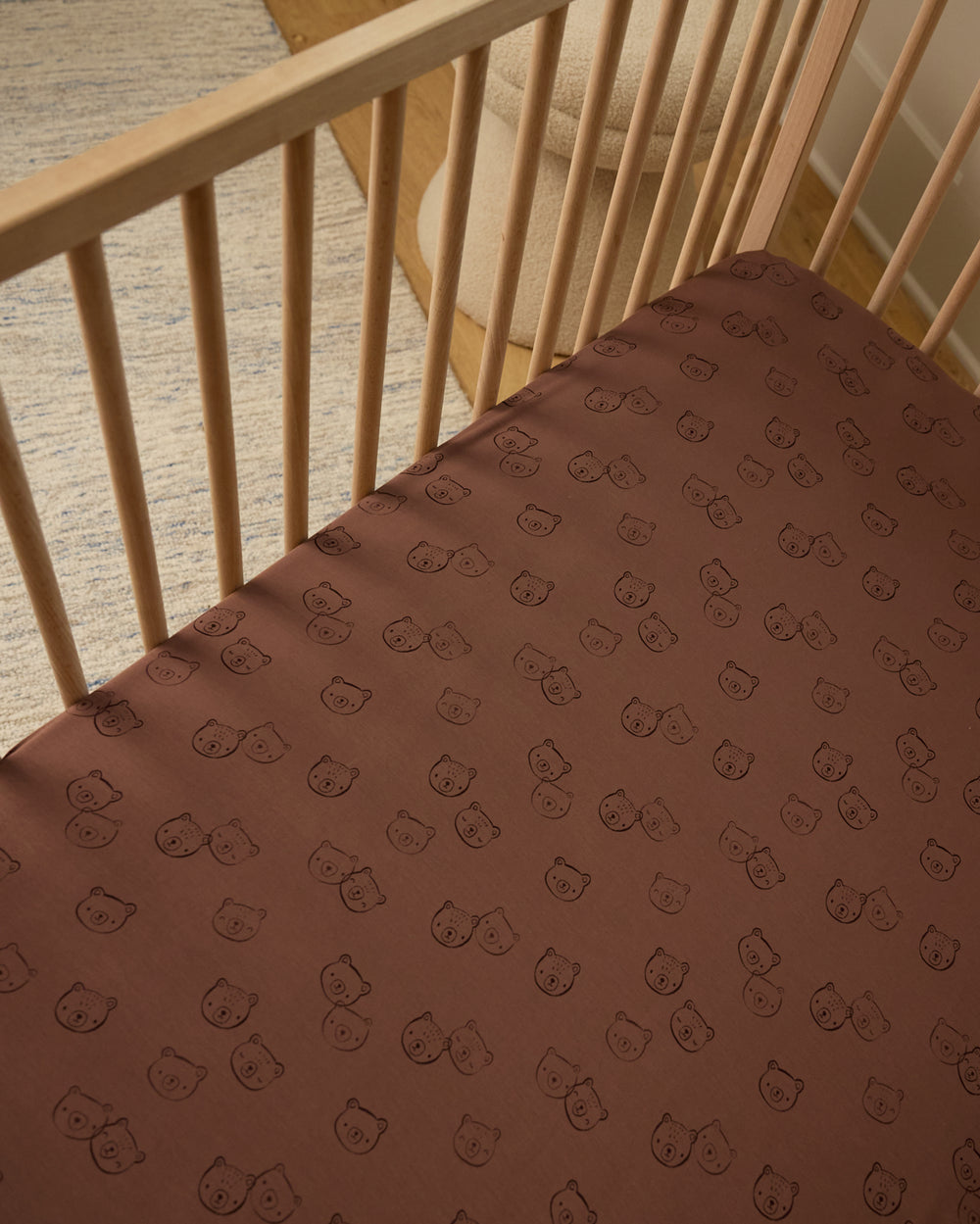 Overhead view of the Teddy Tracks Fitted Crib Sheet