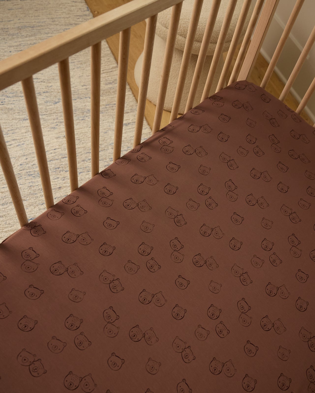 Overhead view of the Teddy Tracks Fitted Crib Sheet