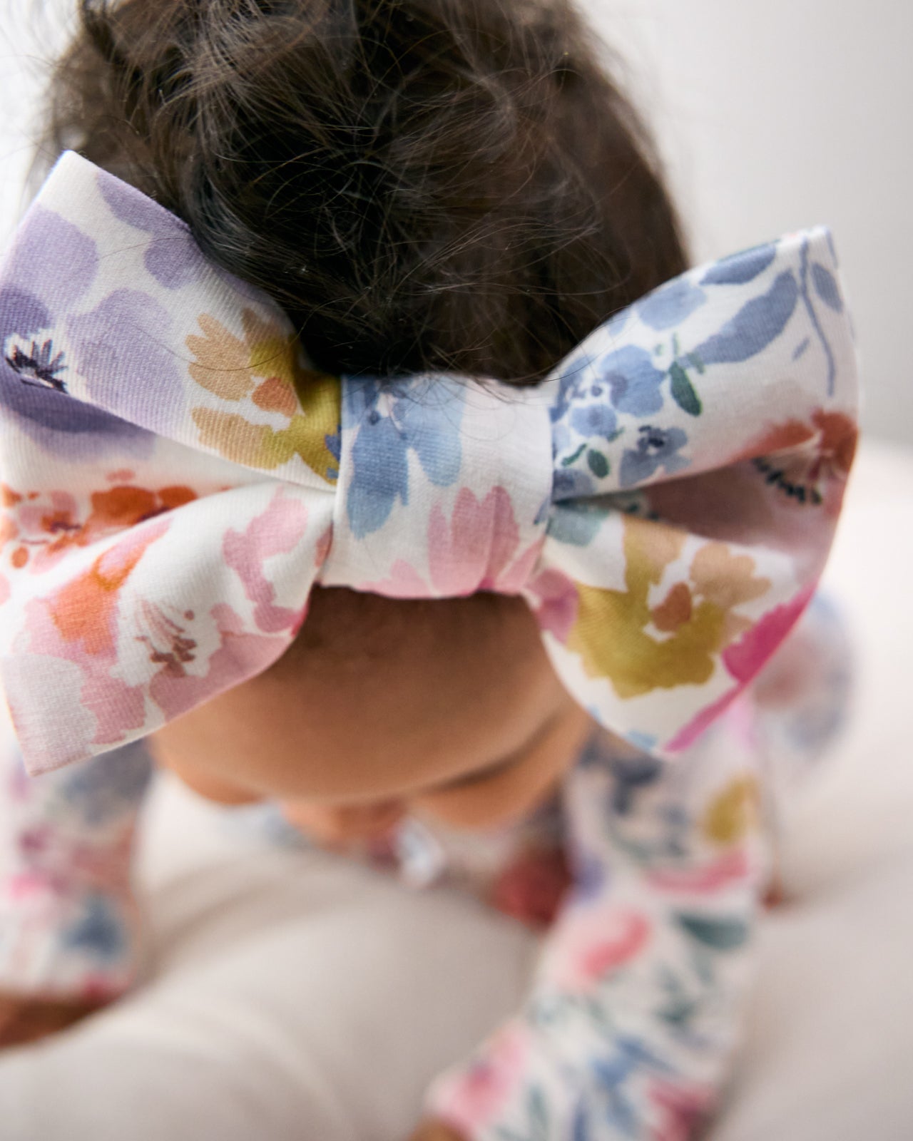 Close up of the Tiny Blooms Luxe Bow Headband