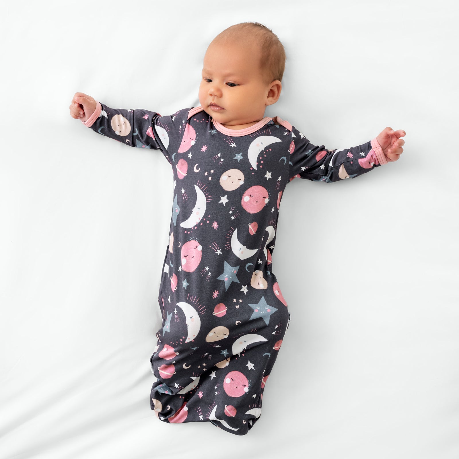 Aerial view of child wearing the Pink To the Moon & Back Infant Gown