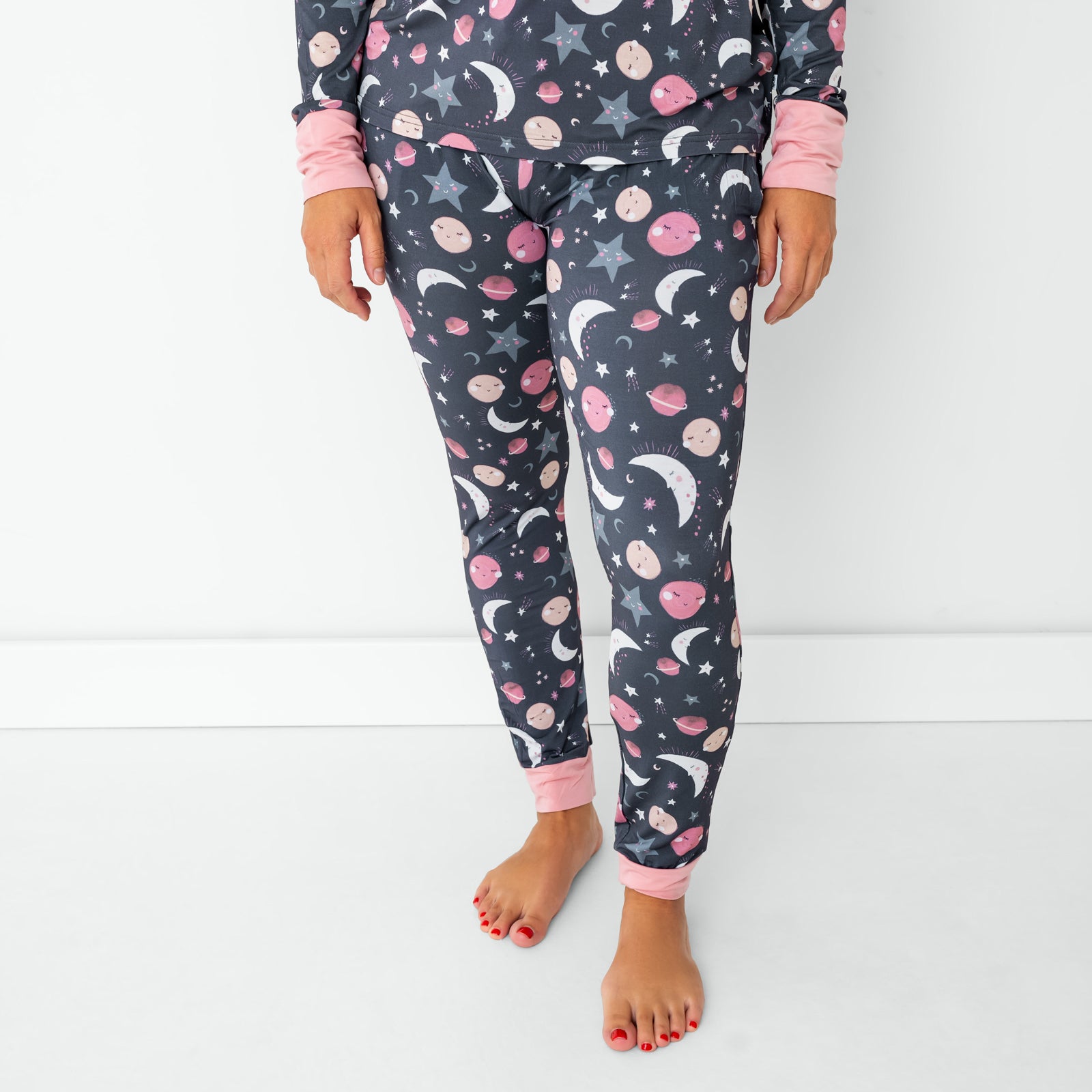Standing woman wearing the Pink To the Moon & Back Women's Bamboo Viscose Pajama Top