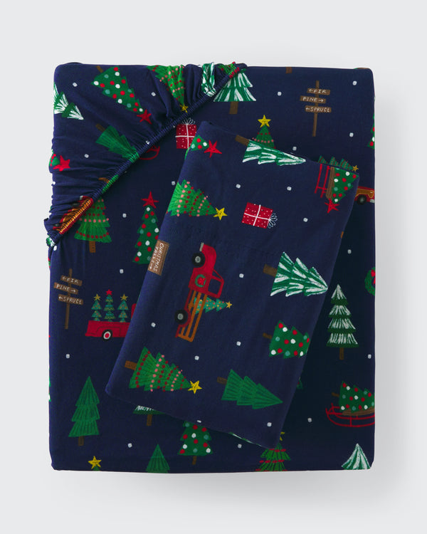 Flat lay of the Navy Tree Traffic Twin Sheet Set