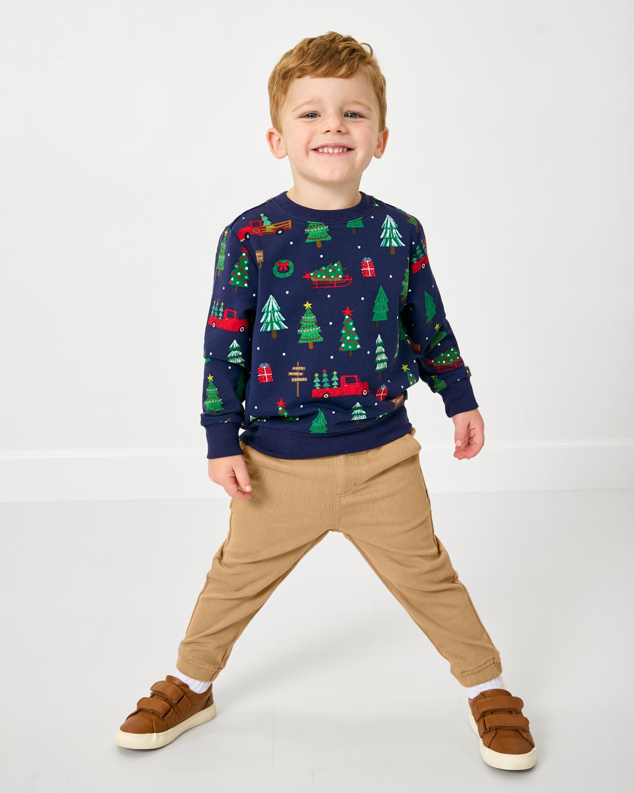 Boy wearing the Navy Tree Traffic Crewneck Sweatshirt with khaki joggers