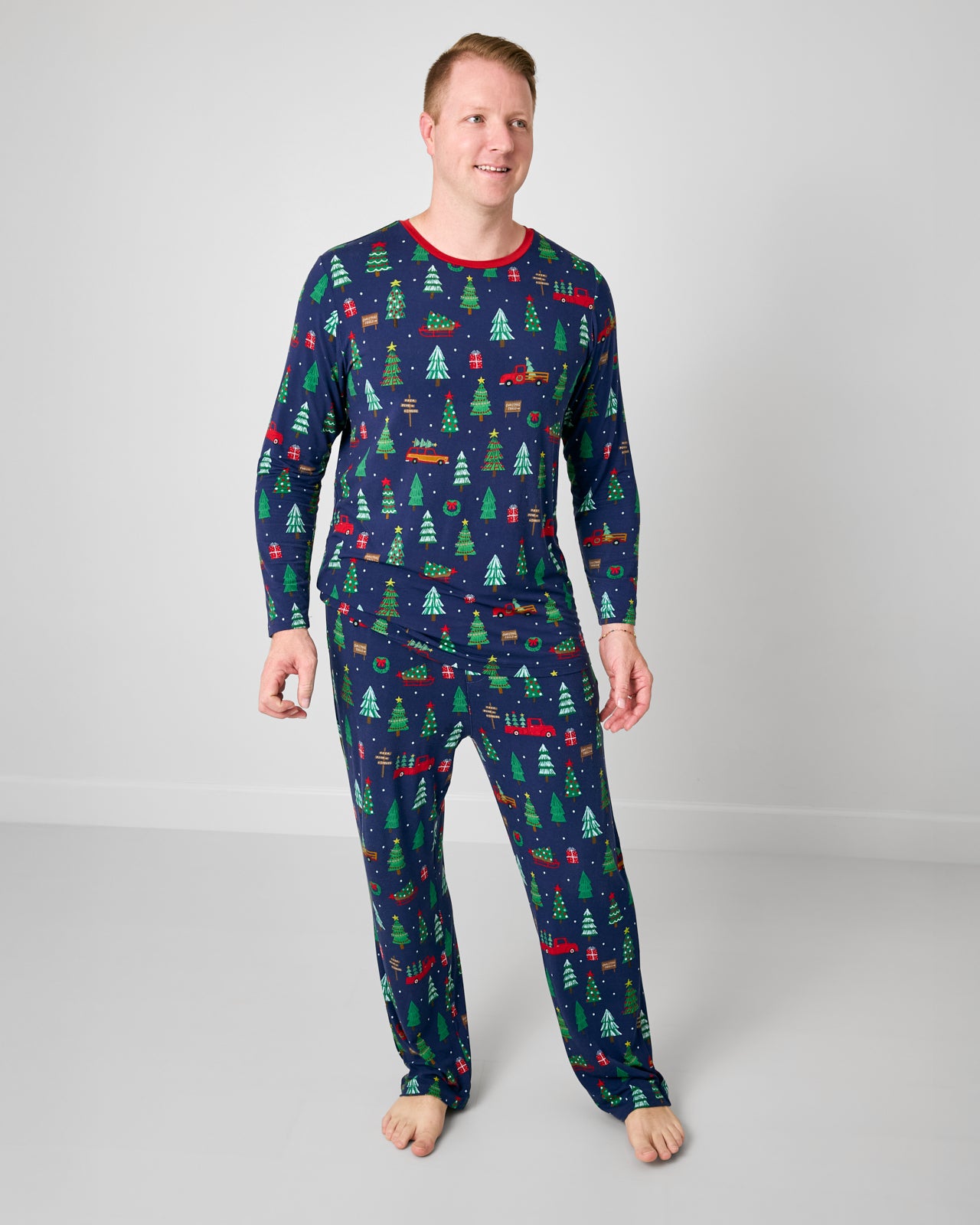 Man wearing the Navy Tree Traffic Men's Long Sleeve Pajama Top with coordinating pants