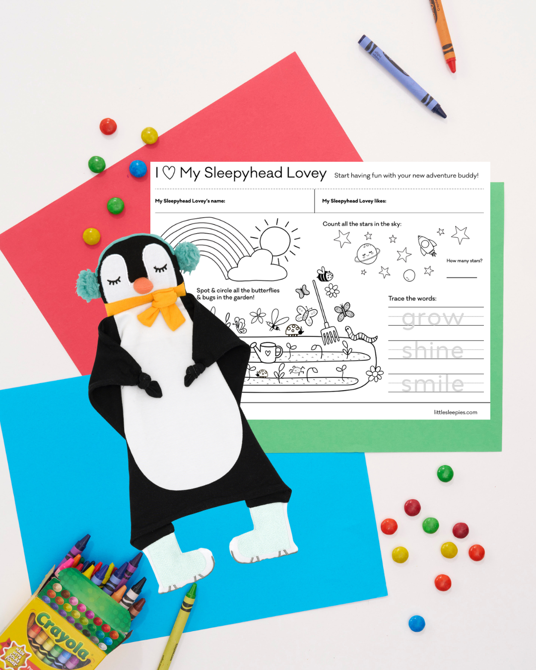 flat lay image of Tux the Penguin with their coloring sheet