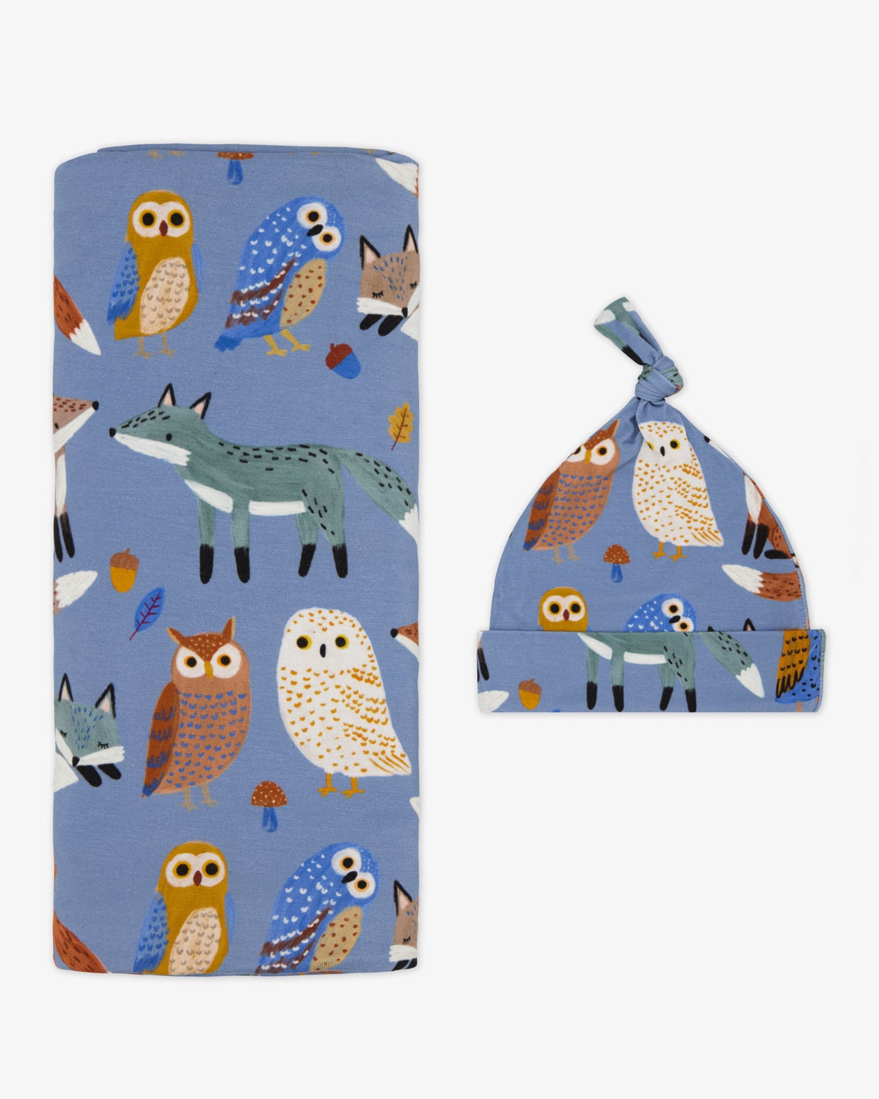 Flat lay of the Twilight Pals Swaddle & Hat Set