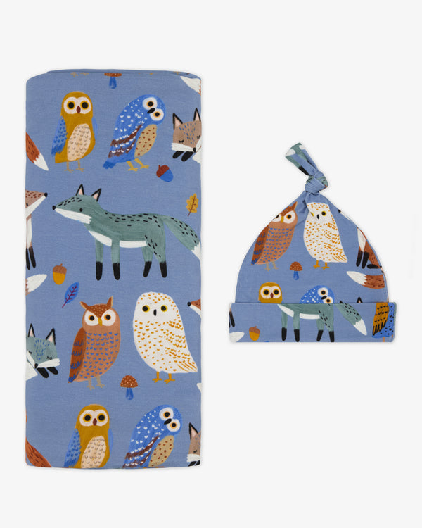 Flat lay of the Twilight Pals Swaddle & Hat Set