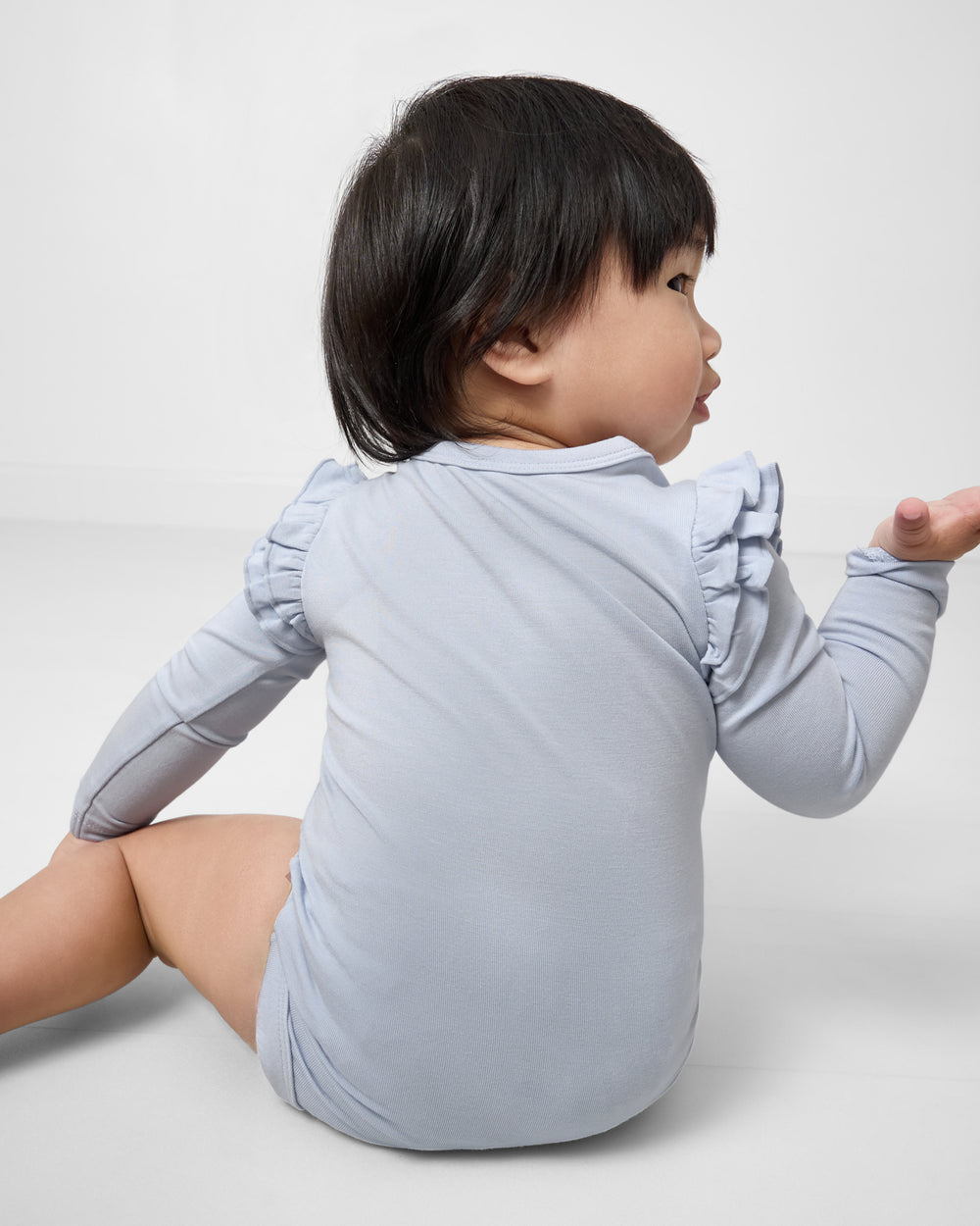 Back view of baby wearing the Unicorn Flutter Bodysuit