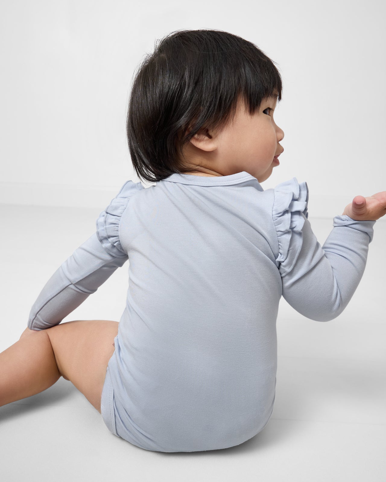 Back view of baby wearing the Unicorn Flutter Bodysuit