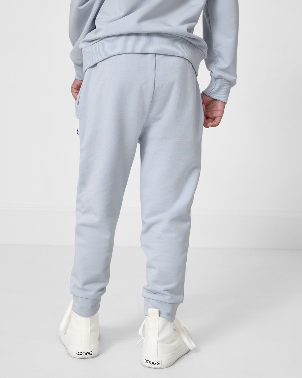 Back view of girl wearing the Soft Blue Ruffle Jogger
