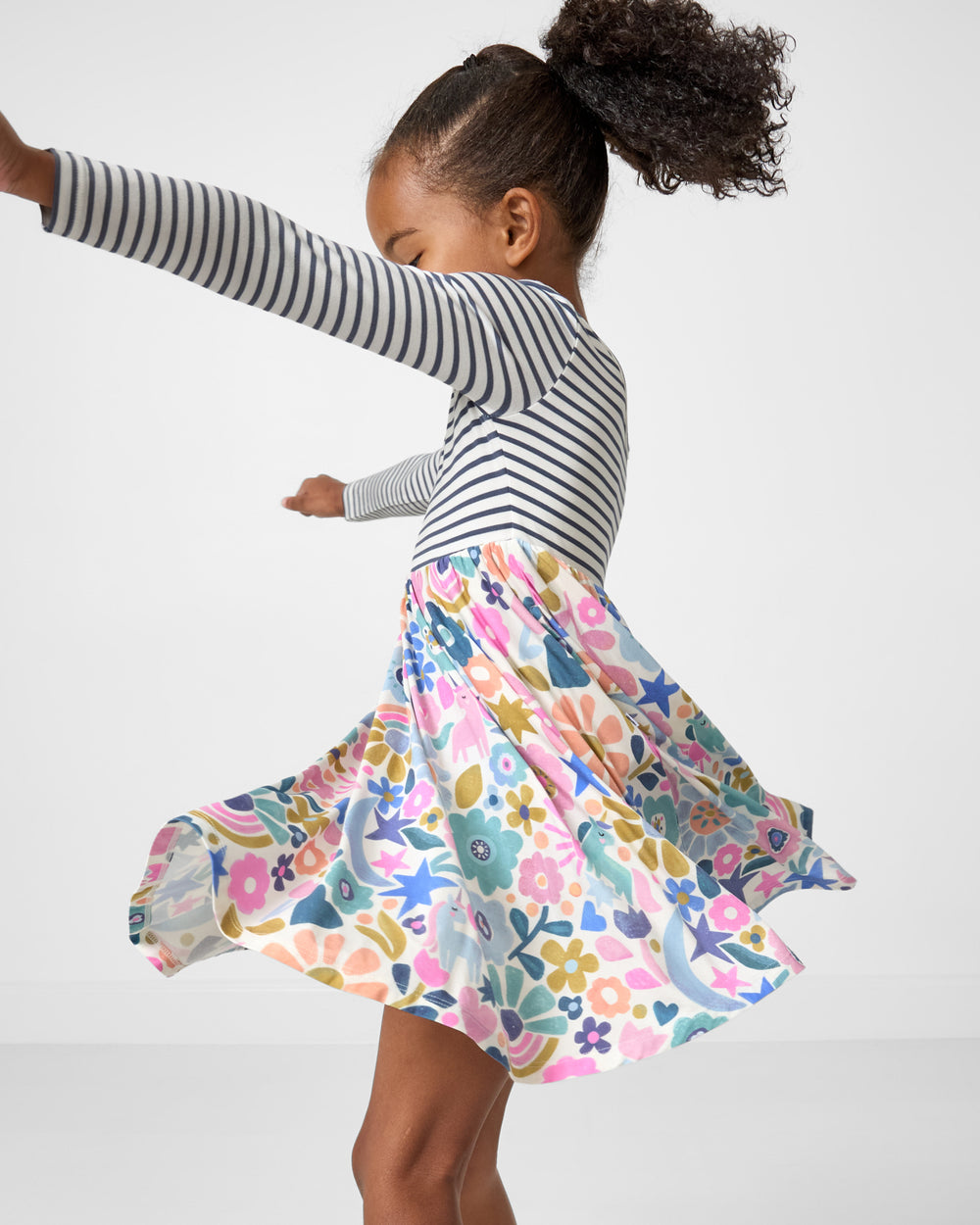 Twirling girl wearing the Unicorn Blossoms Twirl Dress