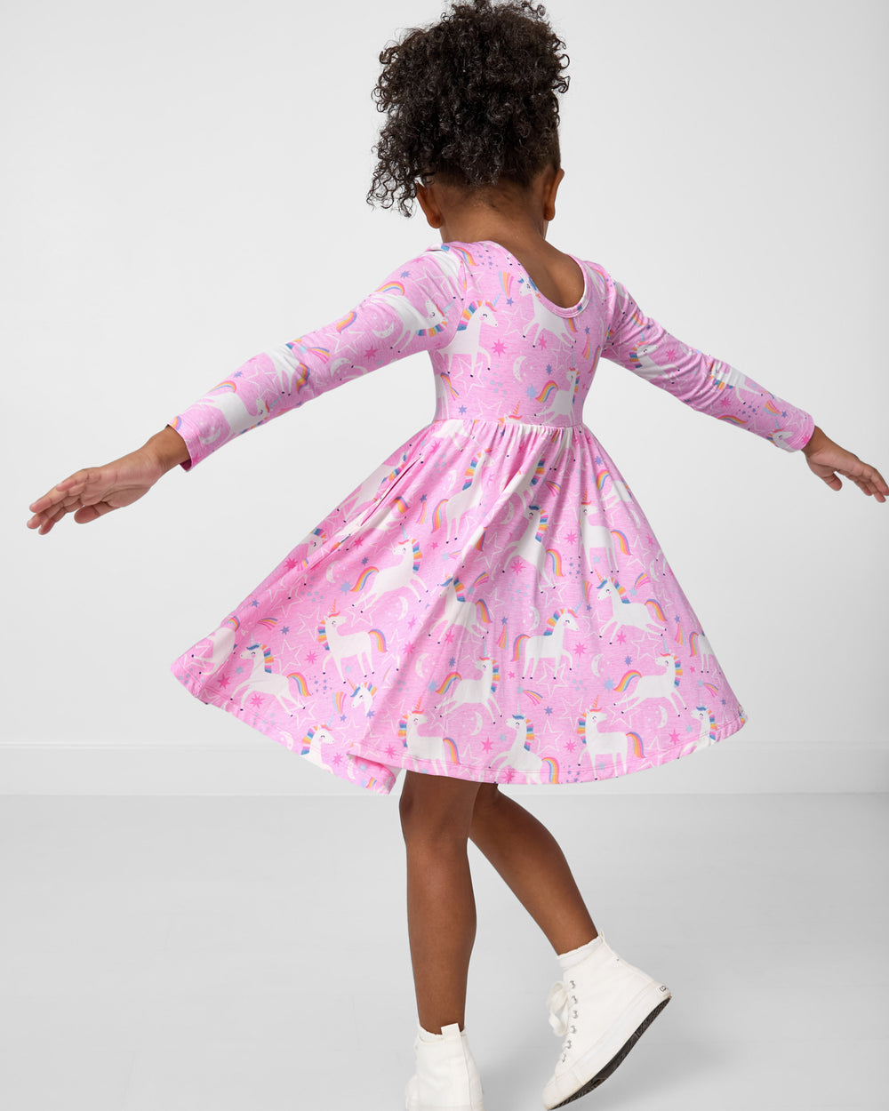Twirling girl wearing the Unicorn Dance Twirl Dress