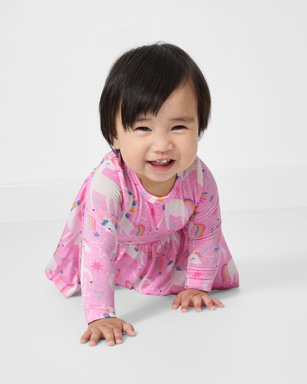 Crawling baby wearing the Unicorn Dance Twirl Dress with Bodysuit