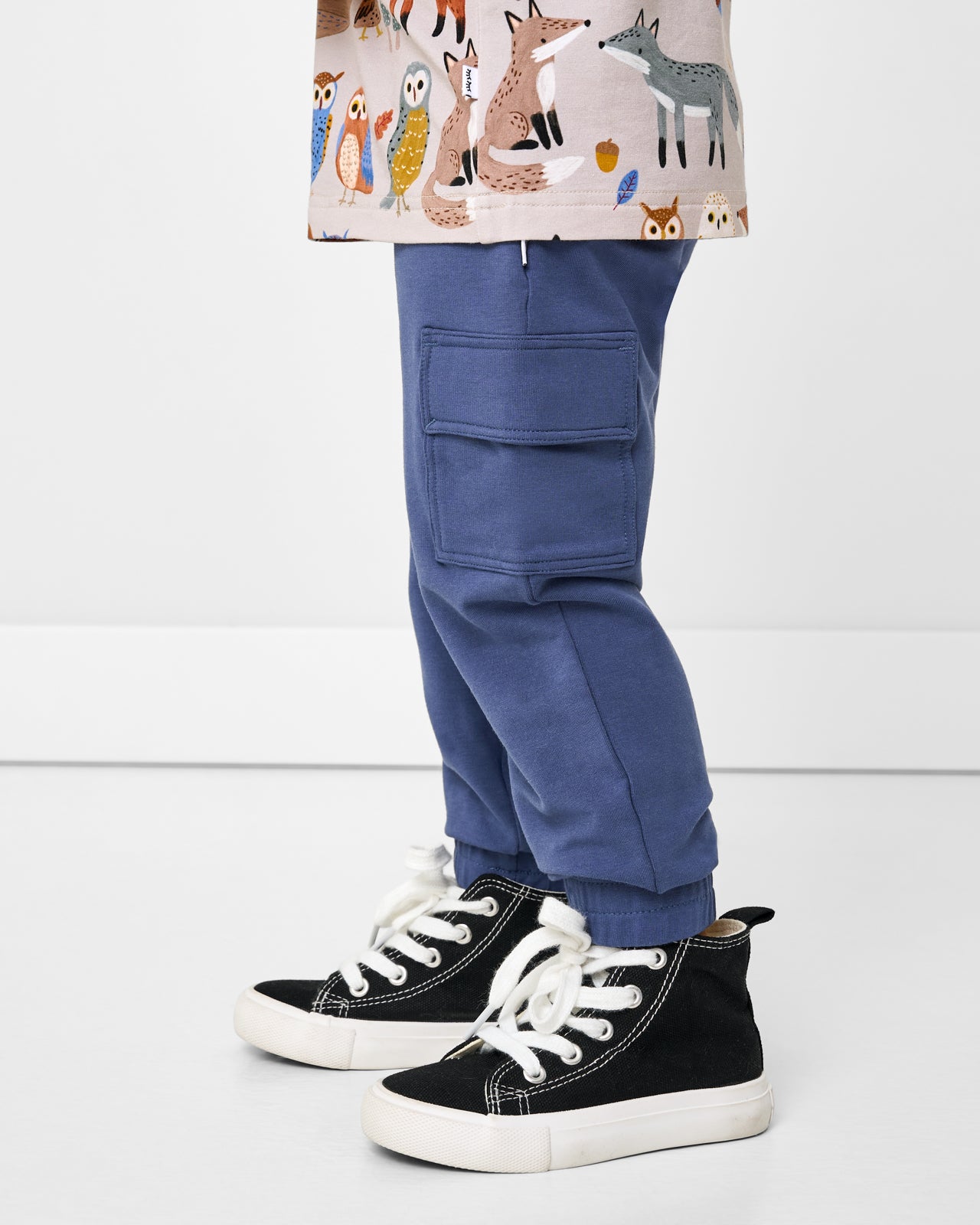 Side view of boy wearing the Vintage Navy Cargo Jogger