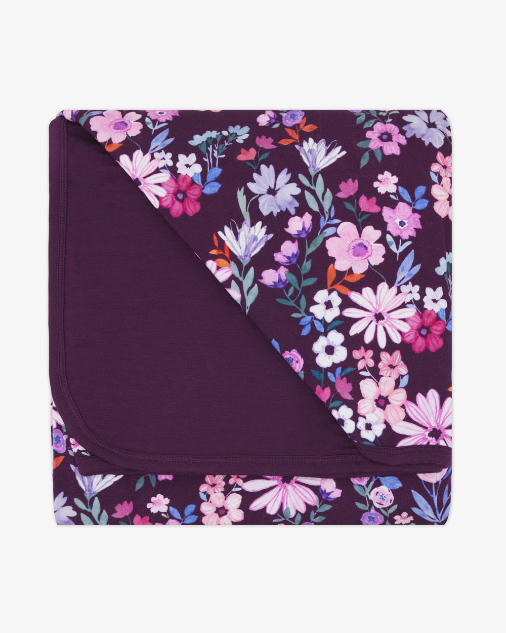 Flat lay of the Violet Meadow Large Cloud Blanket®