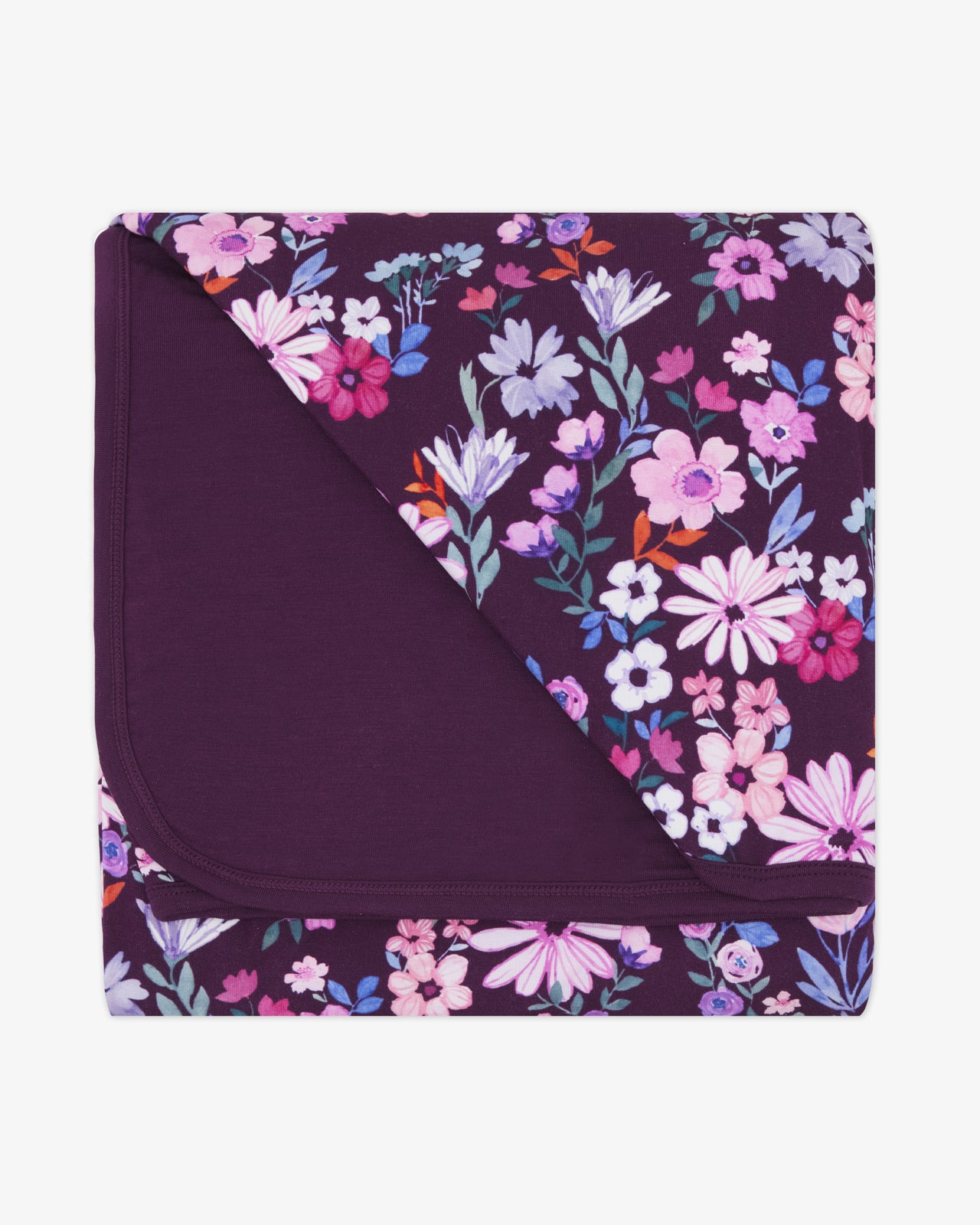 Flat lay of the Violet Meadow Large Cloud Blanket®