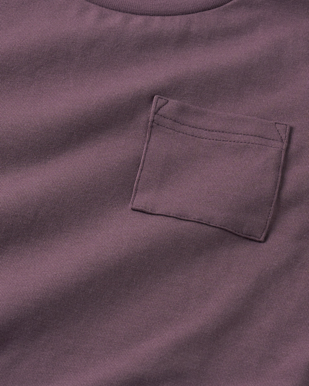 Close up of the pocket detail on the Vintage Plum Relaxed Pocket Tee