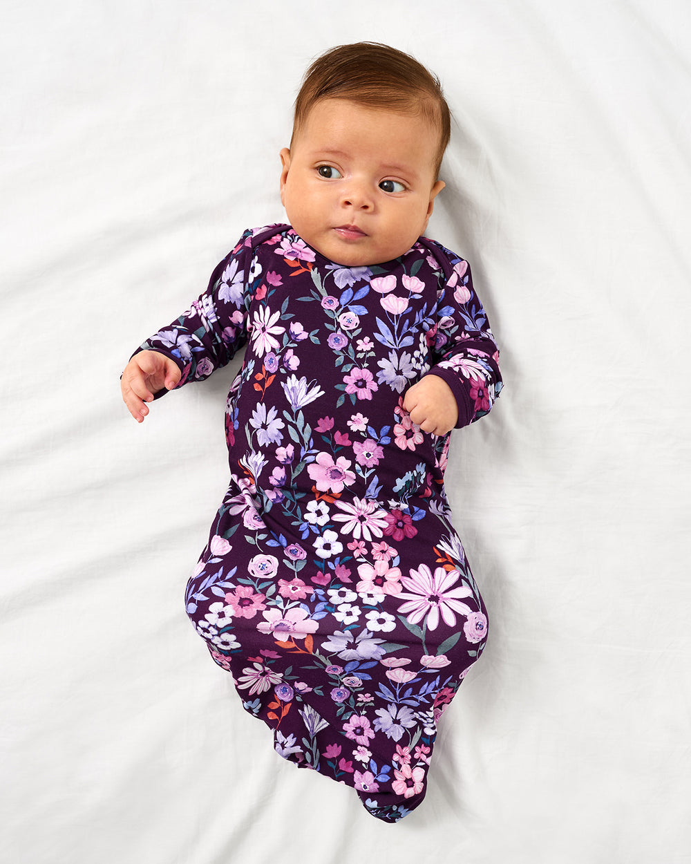 Alternate aerial view of baby in the Violet Meadow Infant Gown