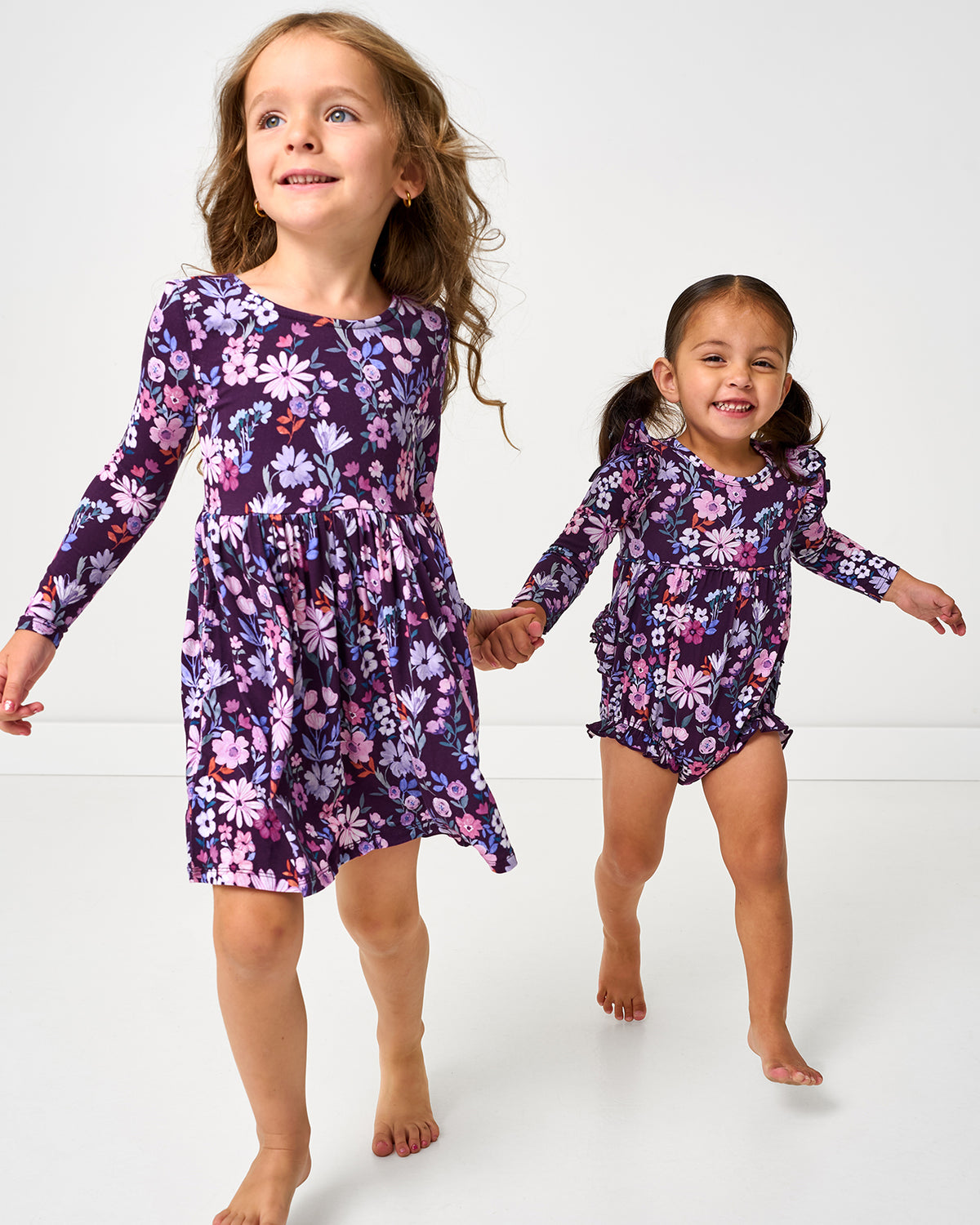 Two girls wearing matching Violet Meadows styles